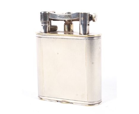 An early 20th century Dunhill silver-plated table lighter. With engine turned decoration, bearing Dunhill mark, stamped with 