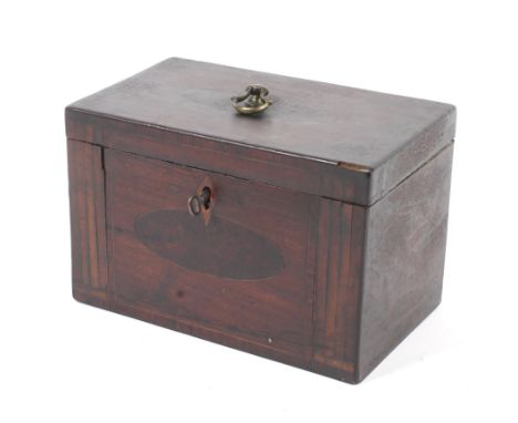A Georgian mahogany tea caddy. With ring handle and key, the rising lid to twin compartments. (lining missing). The body with
