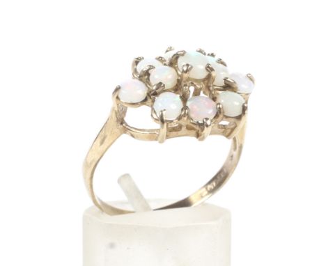 A 9ct gold hallmarked  opal cluster ring. Set with eleven opals in three rows, Weight 2.9 ghrams, size S