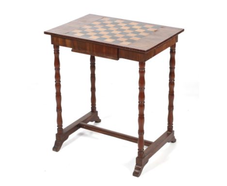 A 19th century draughts/chess table. With central frieze drawer, the chess board with ebony and satinwood check, raised on bo