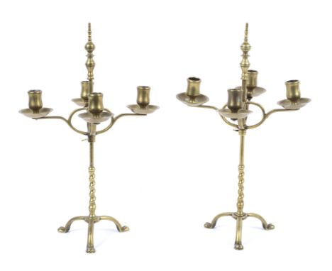 A pair of late 19th century adjustable brass four light candlesticks. In the style of WAS Benson. With baluster finials and f