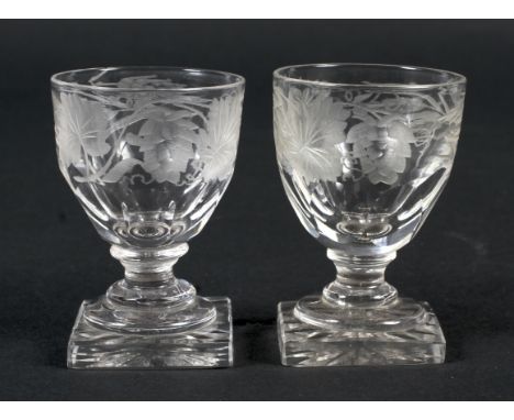 A pair of early 19th century engraved glass small drinking glasses. Of rummer form, engraved with a band of hops and barley, 