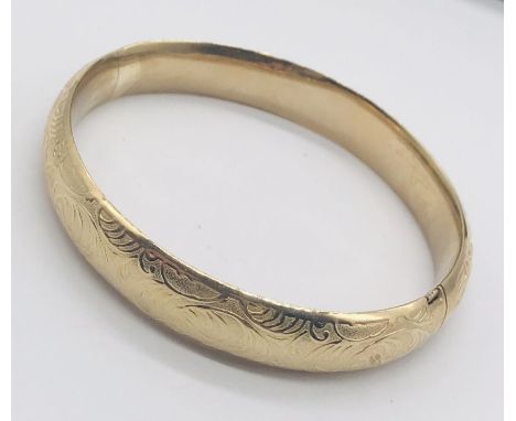 A 9ct gold hinged bangle, weight 12.7g