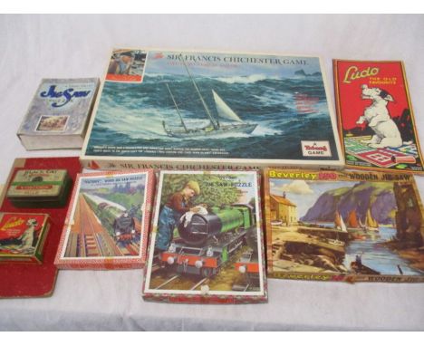 A collection of vintage jigsaw puzzles including "Victory" plywood, Chad Valley etc, along with Ludo, draughts board/counters