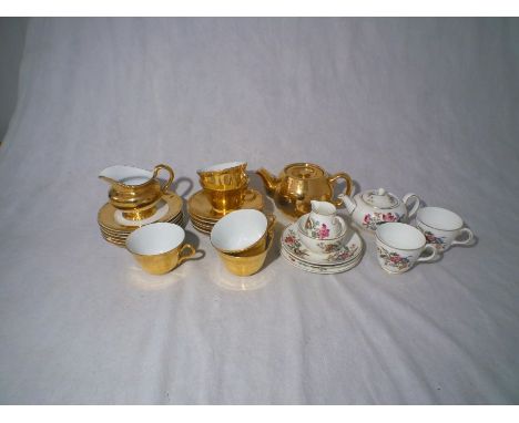 A Royal Worcester china part tea set, along with a Wedgwood 'Sandon' pattern bone china part tea set.