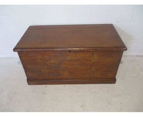 A vintage pine storage trunk