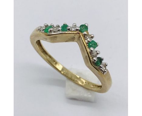 An emerald and diamond ring in 9ct gold