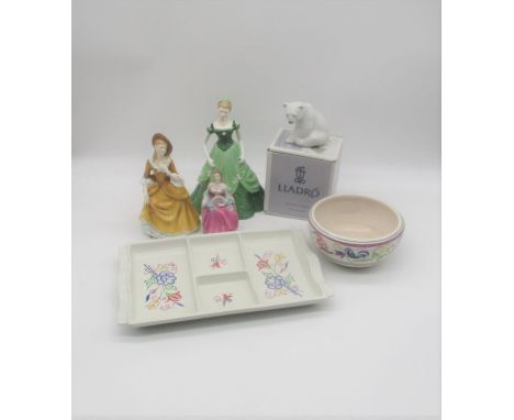 A Poole pottery bowl, along with a Poole pottery dish, a boxed Lladro polar bear and three figures, including Royal Doulton, 