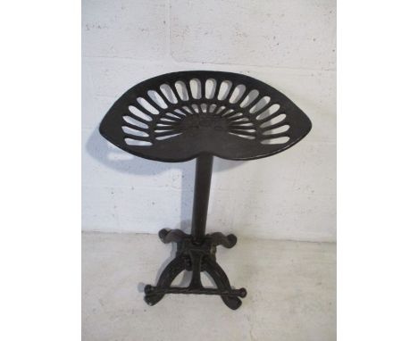 A vintage tractor seat stool 