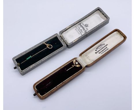 A 9ct gold stick pin along with one other (unmarked)- both cased