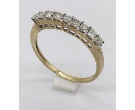 A 9ct gold half eternity ring set with diamonds