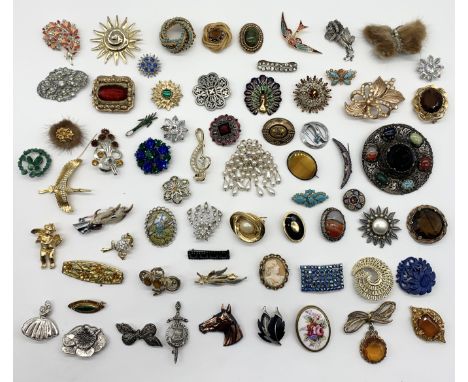 A collection of various vintage brooches