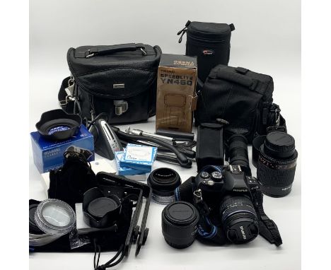 An Olympus E-420 camera along with numerous lenses, filters, bags, instruction manual and accessories 