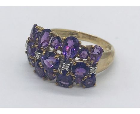 An amethyst cluster ring set in 9ct gold