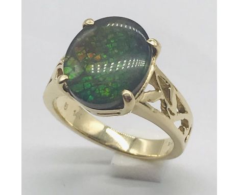 A 14ct gold opal style ring, weight 4.7g