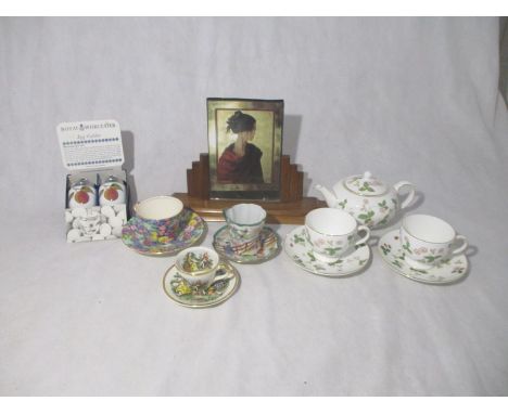 An Art Deco photo frame along with a quantity of ceramics including a Wedgwood tea pot and pair of cups and saucers etc.