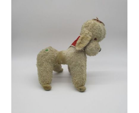A vintage Merry Thought poodle soft toy.