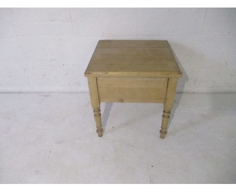 An antique pine commode.