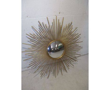 A vintage style sun burst convex mirror
