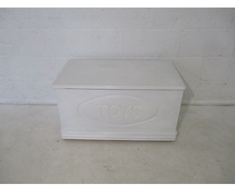 A white painted child's toy trunk, length 85cm.