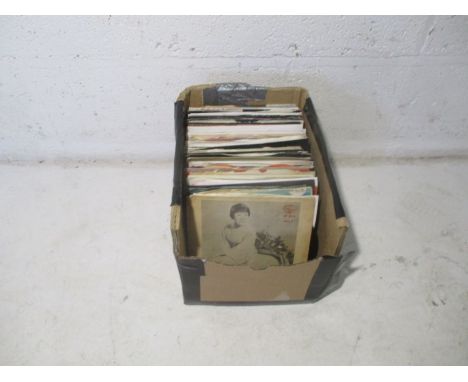 A quantity of 7" vinyl records, including The Rolling Stones, Gene Vincent, Norman Greenbaum, Rainbow etc.