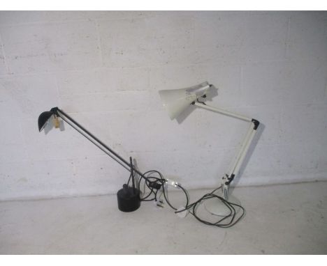 A white angle poise lamp, along with two others.
