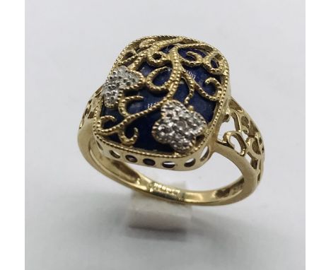 An enamel and diamond ring set in 9ct gold