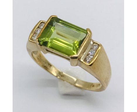 A tourmaline and diamond 9ct gold ring