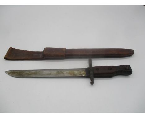 A World War 1 bayonet with leather sheaf. Bayonet bears the markings Ross Rifle Co.Quebec and on the other side a broad arrow