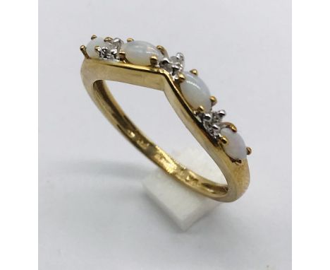 A 9ct gold opal and diamond ring