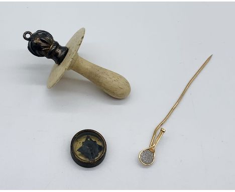 A hallmarked silver and bone babies dummy, a small compass (possibly escape and evasion WWII compass) along with a gold colou