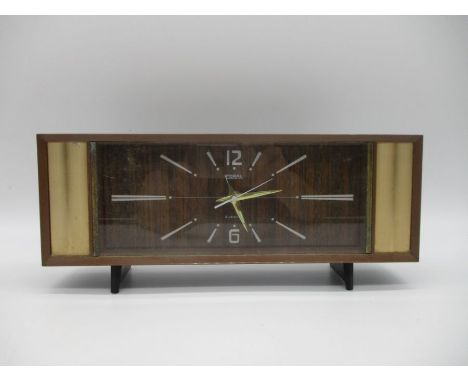 A vintage Coral alarm clock.