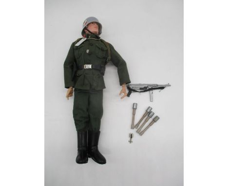 A Palitoy vintage Action Man "Soldiers of The Century" German Stormtrooper with iron cross, schmeisser etc