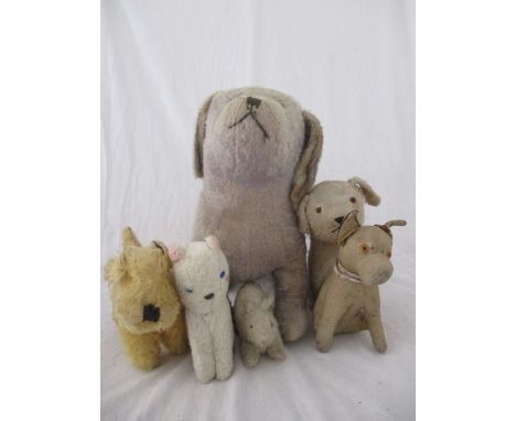 A collection of vintage play worn animal soft toys, including dogs, cat, etc