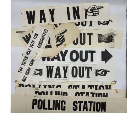 A collection of vintage polling station signs including way in, way out etc.