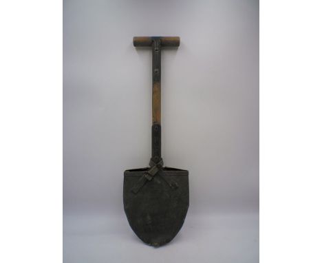A WW2 US Army entrenching tool M1910 pattern T handle shovel. Maker marked and dated "Ames 1942" and complete with cover
