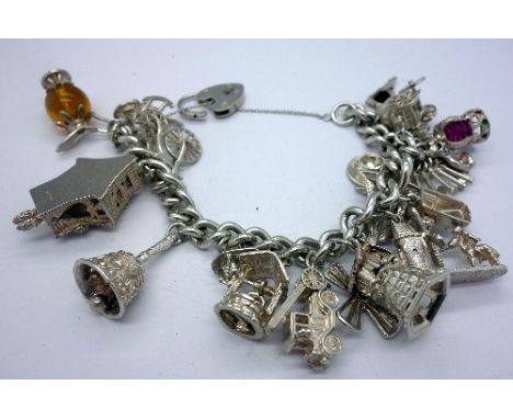 A silver charm bracelet, weight 103g