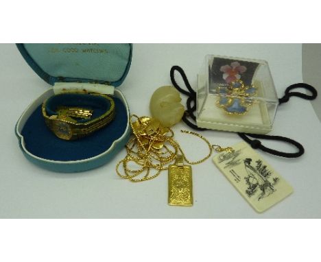 A jade pendant, a lady's wristwatch, etc.