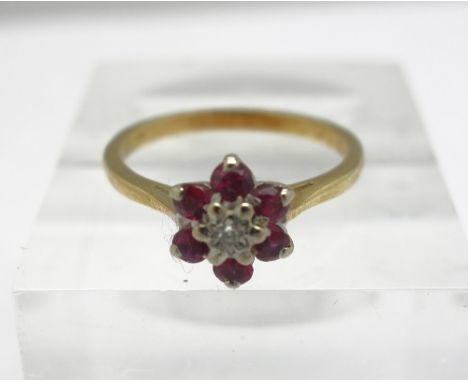 An 18ct gold, diamond and ruby ring, weight 2.9g, size N