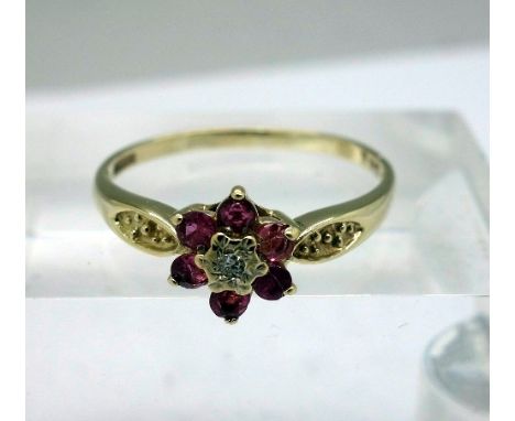 A 9ct gold ruby and diamond cluster ring, weight 2.1g, size T