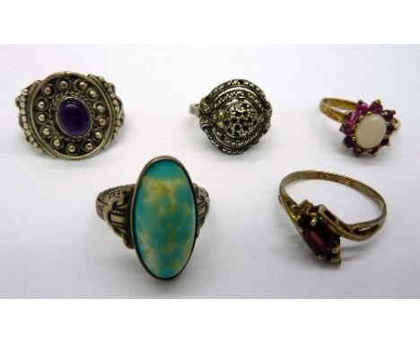 Five silver rings 
