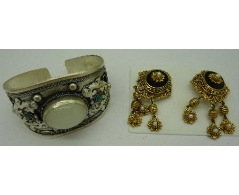 A bangle and a pair of earrings