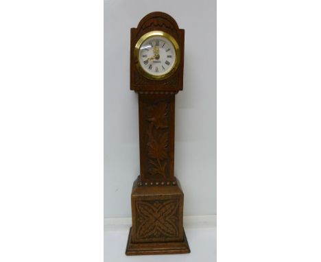 A miniature Black Forest longcase clock