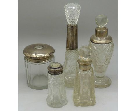 Three silver rimmed bottles, a silver topped jar and a silver topped pepper, a/f