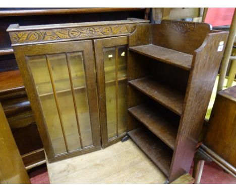 Twin glazed door display cabinet with carvings and a four shelf polished wood slim bookcase