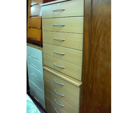 Pair of modern light wood matching five drawer bedroom chests