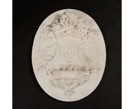 Neapolitan Baroque Aqua Santa, oval white marble plinth with masterly and deeply sculpted reliefs of Maria in the centre surr