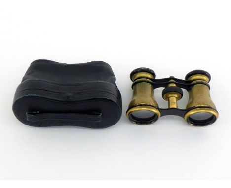 A pair of opera glasses in brass with black enamel finish. Both barrels are well engraved with bluebirds in a landscape, orig