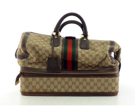 A Vintage Gucci monogrammed Weekender travel bag with leather handles and separate compartment to base, Labelled inside Gucci