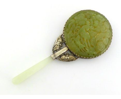 A Chinese hand mirror with white metal mount, back mounted with pierced and carved nephrite jade in deer pattern, 20th centur